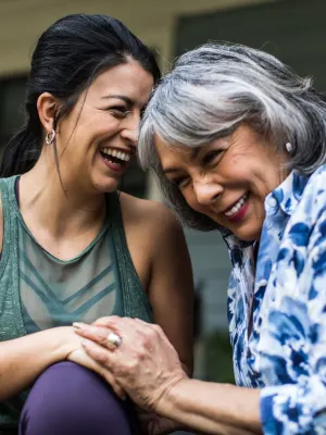 a woman and her mother laughing together at The Hudson Oaks