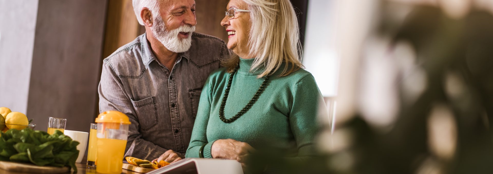 an older couple sitting at a table with food at The Hudson Oaks